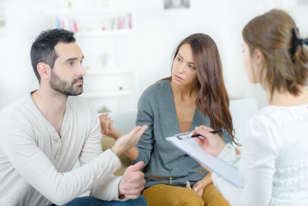 stressed young couple quarrel at the psychologist