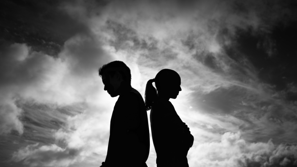 Couple with their backs turned away to each other